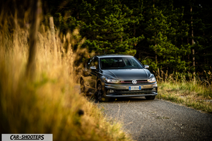 Volkswagen Polo GTI – front three-quarter, grey metallic on a country road