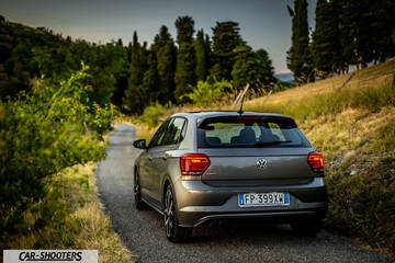 Volkswagen Polo GTI – rear three-quarter, grey metallic on a country road
