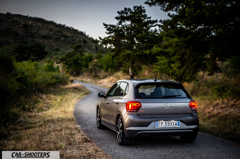 Volkswagen Polo GTI – rear three-quarter, grey metallic on a winding road