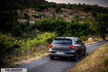 Volkswagen Polo GTI – rear three-quarter, grey metallic on a country road