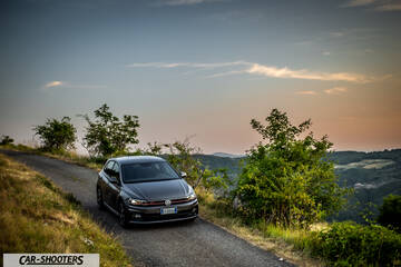Volkswagen Polo GTI – front three-quarter, grey metallic on a country road