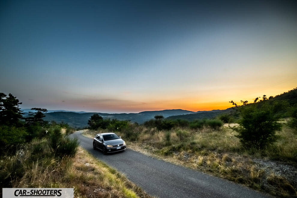 Volkswagen Polo GTI – front three-quarter, grey metallic on a winding country road