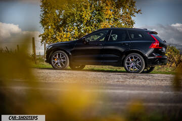 Volvo XC60 Polestar – side profile, black on a country road