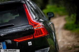 Volvo XC60 Polestar – rear three-quarter, black on a dirt road