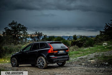 Volvo XC60 Polestar – rear three-quarter, black on a dirt road