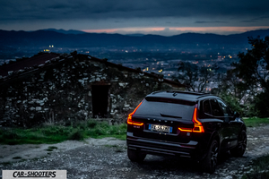 Volvo XC60 Polestar – rear three-quarter, black against a mountain backdrop at dusk