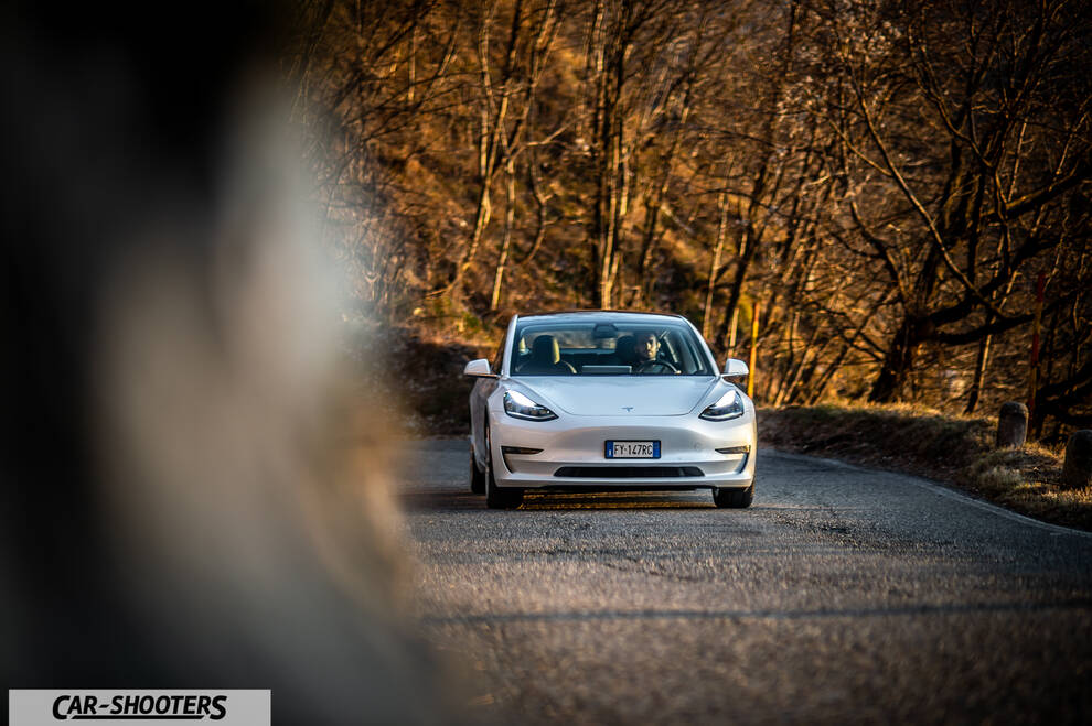 Tesla Model 3 – front three-quarter, white on a country road