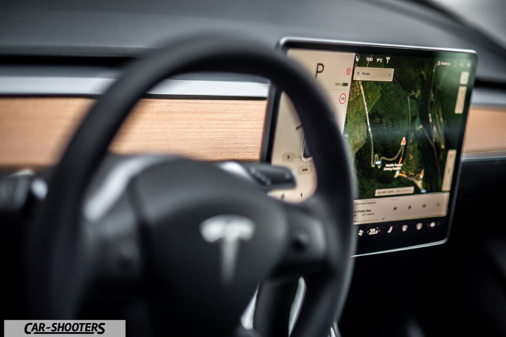 Tesla Model 3 – dashboard, large central touchscreen and steering wheel