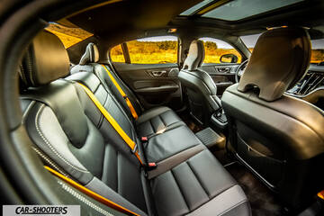 Volvo s60 polestar – interior, black leather interior with yellow seatbelts