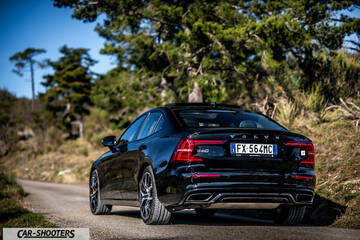 Volvo s60 polestar – rear three-quarter, black on a country road