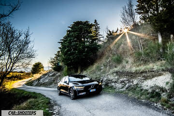 Volvo s60 polestar – front three-quarter, black on a winding country road