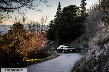 Volvo s60 polestar – front three-quarter, black on a country road