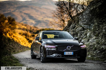 Volvo s60 polestar – front three-quarter, black on a dirt road with mountain backdrop