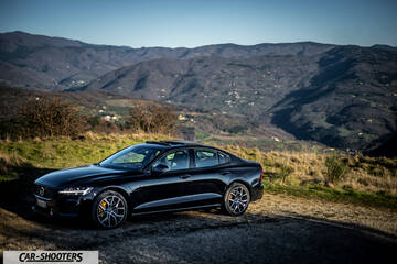 Volvo s60 polestar – front three-quarter, black against a mountain backdrop