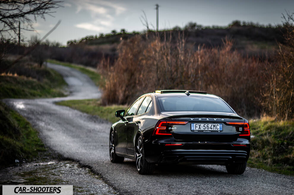 Volvo s60 polestar – rear three-quarter, black on a winding country road