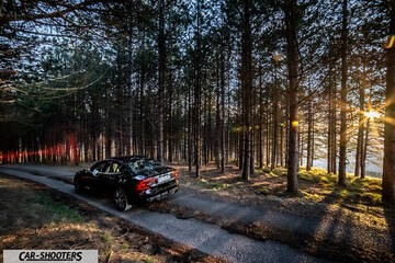 Volvo s60 polestar – rear three-quarter, black on a forest road