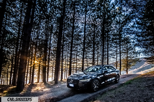 Volvo s60 polestar – front three-quarter, black on a forest road