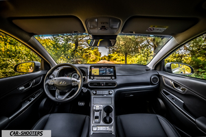 Hyundai Kona electric – dashboard, view from driver seat on road