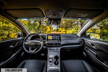 Hyundai Kona electric – dashboard, view from driver seat on road