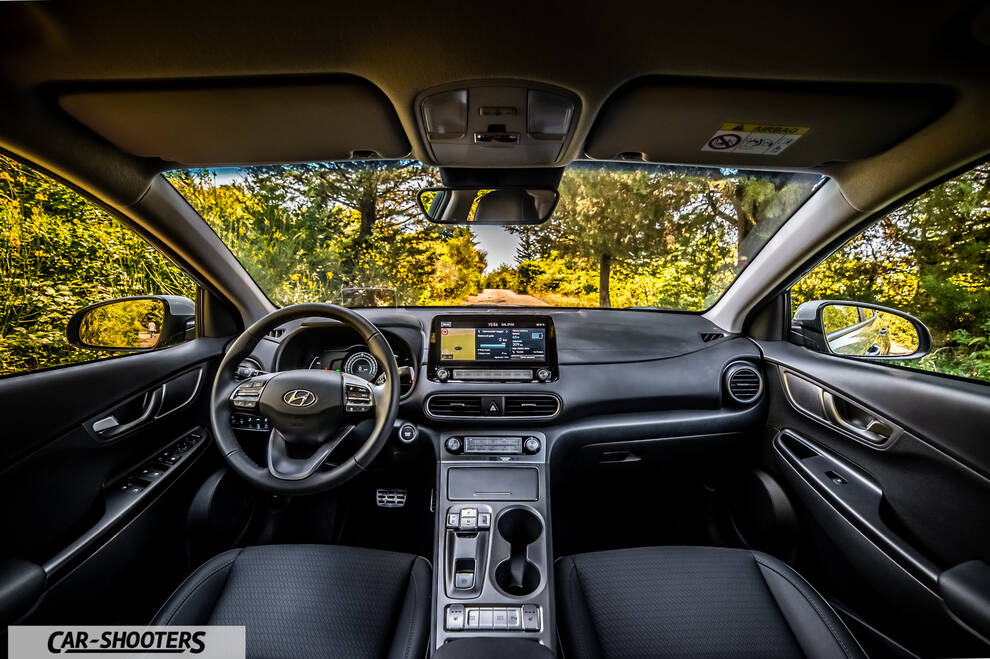 Hyundai Kona electric – dashboard, view from driver seat on road