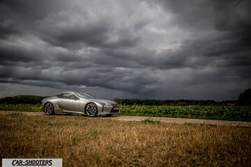 Lexus LC500h – front three-quarter, silver on a country road