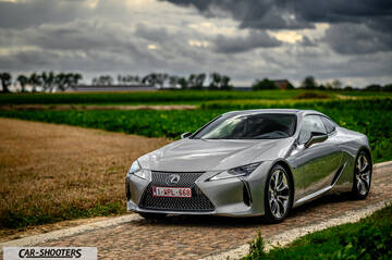 Lexus LC500h – front three-quarter, silver on a country road