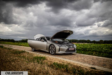 Lexus LC500h – front three-quarter, silver on a country road