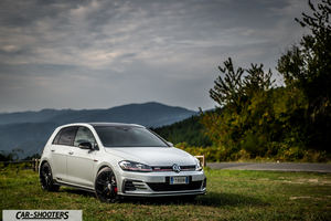 Volkswagen Golf Gti Tcr – front three-quarter, white against a mountain backdrop