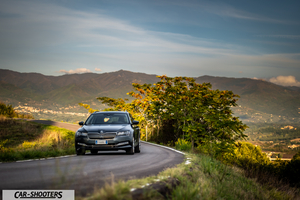 Skoda Superb – front three-quarter, grey metallic on a country road