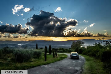 Skoda Superb – rear view, black on a country road