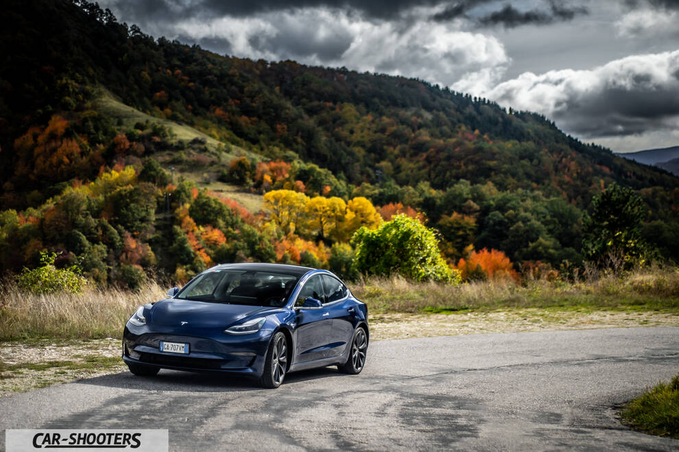 Tesla Model S Performance – front three-quarter, dark blue against a mountain backdrop