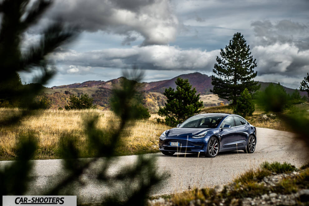 Tesla Model S Performance – front three-quarter, blue metallic on a country road