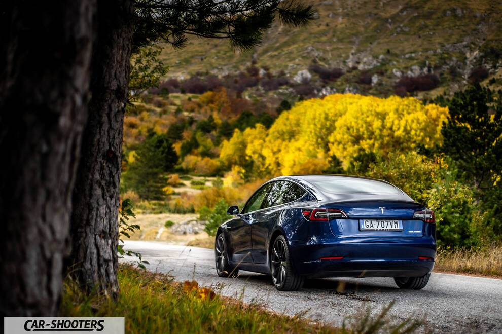 Tesla Model S Performance – rear three-quarter, blue on a mountain road