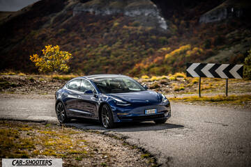 Tesla Model S Performance – front three-quarter, blue on a country road
