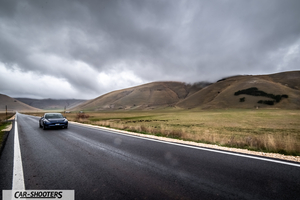 Tesla Model S Performance – front three-quarter, dark blue on a country road
