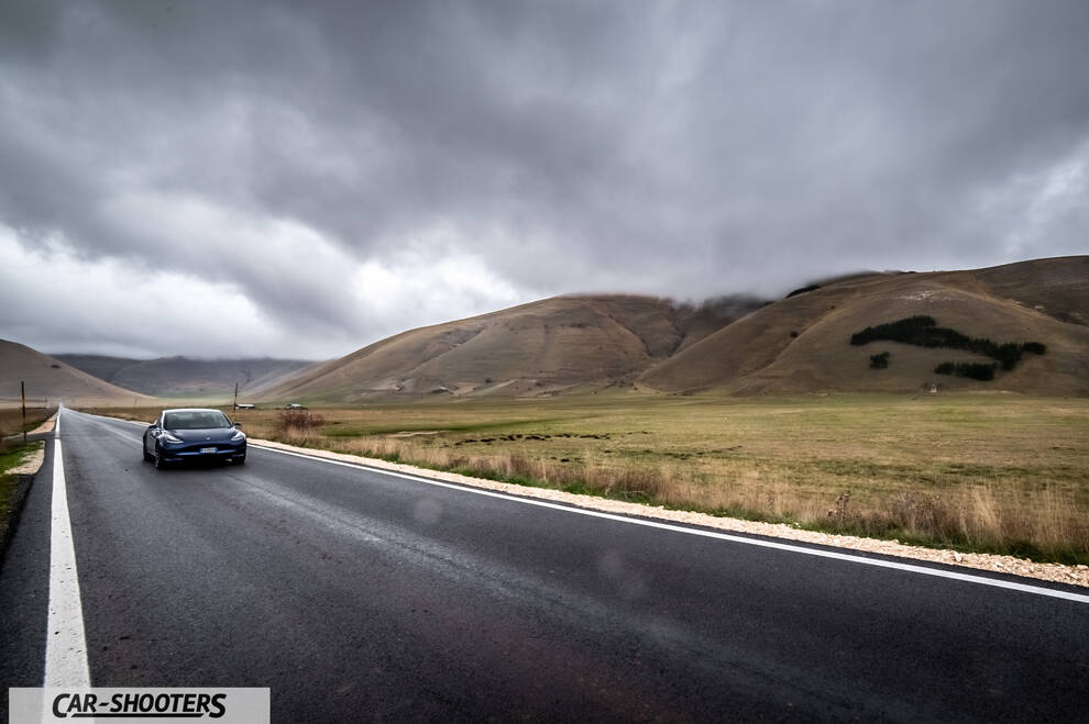 Tesla Model S Performance – front three-quarter, dark blue on a country road