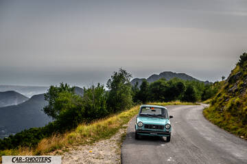Autobianchi A112 – front three-quarter, light blue on a mountain road