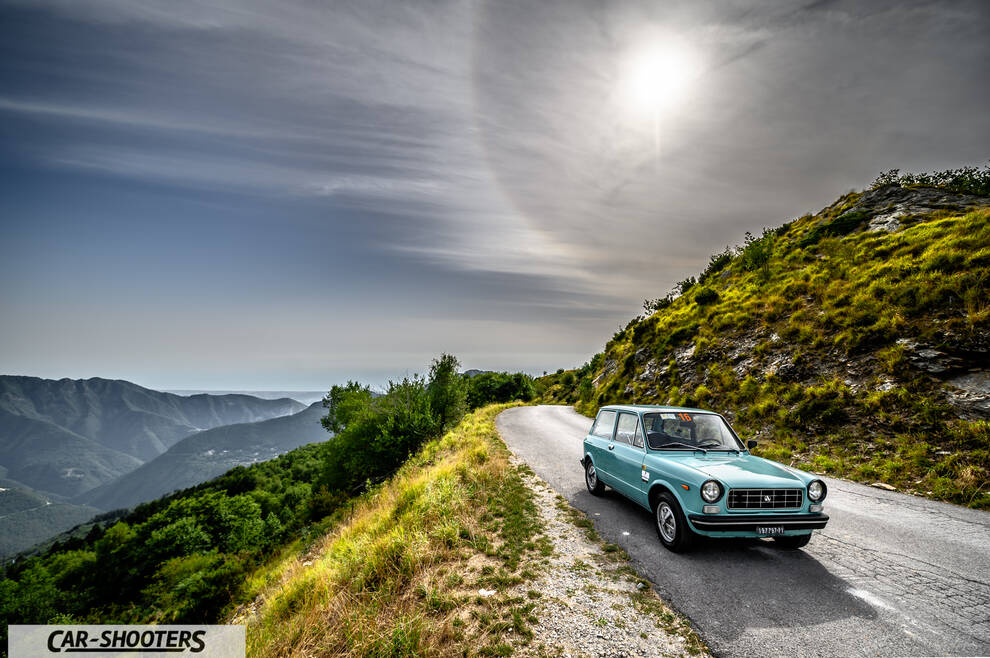 Autobianchi A112 – front three-quarter, light blue on a mountain road