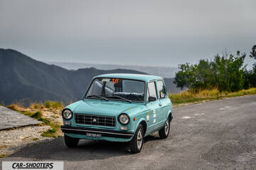 Autobianchi A112 – front three-quarter, light blue on a mountain road
