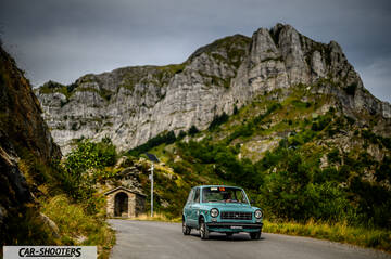 Autobianchi A112 – front three-quarter, light blue against a mountain backdrop