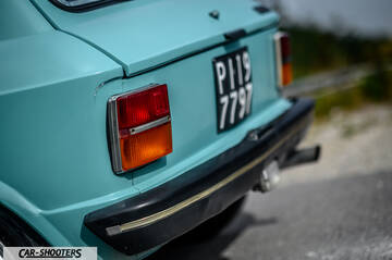 Autobianchi A112 – rear view, light blue on a road