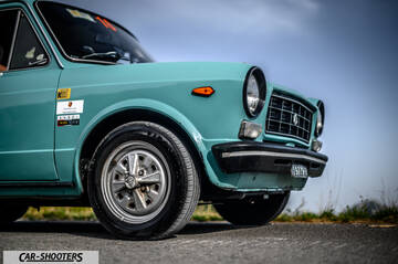 Autobianchi A112 – front three-quarter, light blue on an asphalt road