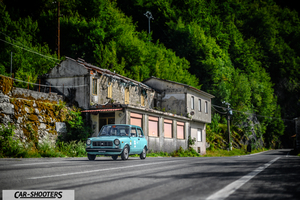 Autobianchi A112 – front three-quarter, light blue on a country road