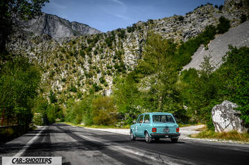 Autobianchi A112 – rear three-quarter, light blue on a mountain road