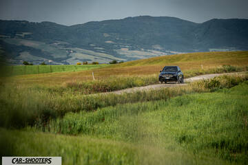 Mercedes Benz GLE – front three-quarter, black against a mountain backdrop