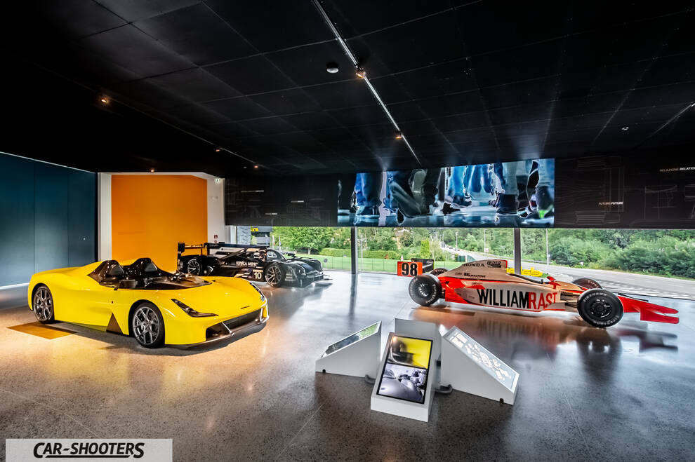 Dallara – front three-quarter, yellow in a showroom