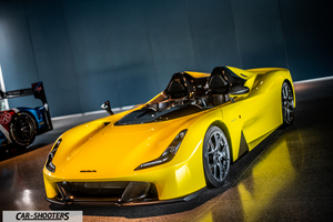Dallara – front three-quarter, yellow in an indoor showroom