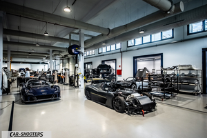 Dallara – front three-quarter, dark blue in a factory assembly hall