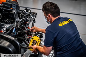 Dallara – engine bay, mechanic working on suspension components