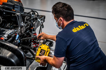 Dallara – engine bay, mechanic working on suspension components